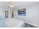 Bright bedroom with large art piece and plenty of light at 2960 59Th S St # 103, Gulfport, FL 33707