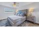 King sized bed, updated furnishings, and large window at 2960 59Th S St # 103, Gulfport, FL 33707