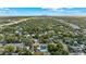 Aerial view of a residential neighborhood with trees and city skyline at 306 E Paris St, Tampa, FL 33604