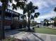 Modern building with palm trees and outdoor seating at 306 E Paris St, Tampa, FL 33604
