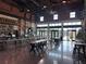 Spacious industrial-style restaurant with bar, tables, and holiday decorations at 306 E Paris St, Tampa, FL 33604