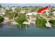 Bird's-eye view of the waterfront home, dock, pool, and backyard space at 307 10Th Ave, Indian Rocks Beach, FL 33785
