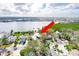 An aerial view of a waterfront home in a residential neighborhood at 307 10Th Ave, Indian Rocks Beach, FL 33785