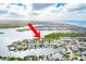 Bird's-eye view highlighting the property's waterfront location and surrounding homes at 307 10Th Ave, Indian Rocks Beach, FL 33785