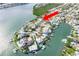 Island home with private dock, surrounded by tranquil waters and lush landscaping at 307 10Th Ave, Indian Rocks Beach, FL 33785