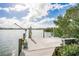 Private dock with boat lift on the water at 307 10Th Ave, Indian Rocks Beach, FL 33785