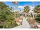 Home with dock and walkway surrounded by lush landscaping at 307 10Th Ave, Indian Rocks Beach, FL 33785