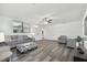 Inviting living room with comfortable seating, stylish decor, and modern wood-look flooring at 3318 W Ellicott St, Tampa, FL 33614