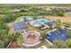 Aerial view of community amenities including pool, playground, basketball court, and parking at 33510 Elm Hill Branch, Wesley Chapel, FL 33545