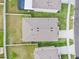 Aerial view of home showcasing backyard, roof, and landscaping in residential neighborhood at 33510 Elm Hill Branch, Wesley Chapel, FL 33545