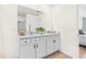Double vanity bathroom with a modern design and plant at 33510 Elm Hill Branch, Wesley Chapel, FL 33545