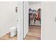 Toilet and access to a large walk-in closet at 33510 Elm Hill Branch, Wesley Chapel, FL 33545