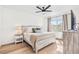 Bright bedroom with a queen-size bed, nightstand, and large window at 33510 Elm Hill Branch, Wesley Chapel, FL 33545
