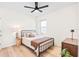 Bedroom with a full-size bed, nightstand, and ceiling fan at 33510 Elm Hill Branch, Wesley Chapel, FL 33545