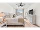 Spacious bedroom with a king-size bed, dresser, and window at 33510 Elm Hill Branch, Wesley Chapel, FL 33545