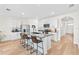 Open concept kitchen with large island, granite countertops, and stainless steel appliances at 33510 Elm Hill Branch, Wesley Chapel, FL 33545