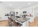 Modern kitchen with stainless steel appliances and a large kitchen island at 33510 Elm Hill Branch, Wesley Chapel, FL 33545