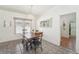 Dining area with a table, bench, and doorway to laundry room at 3709 N Darwin Ave, Tampa, FL 33603