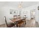 Dining room with wooden table, chairs, and access to another room at 3709 N Darwin Ave, Tampa, FL 33603