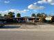 One-story home with a driveway and front yard at 415 86Th Ave, St Pete Beach, FL 33706