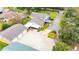 Aerial view showcasing the home, garage, driveway, and fenced yard at 4823 Miley Rd, Plant City, FL 33565