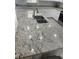 Close-up of the granite countertop in a modern kitchen with white cabinets at 5440 Paula St, North Port, FL 34286