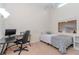 Bedroom with a desk, bed and a view to an open loft area at 6289 93Rd N Ter # 4302, Pinellas Park, FL 33782