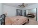 Bright bedroom with a comfortable bed and sliding door access to a balcony at 6289 93Rd N Ter # 4302, Pinellas Park, FL 33782