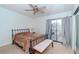 Spacious bedroom with balcony access and ceiling fan at 6289 93Rd N Ter # 4302, Pinellas Park, FL 33782