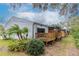 Back exterior of townhouses with private decks and tropical landscaping at 6289 93Rd N Ter # 4302, Pinellas Park, FL 33782