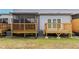 Rear view of townhouses featuring individual wooden decks at 6289 93Rd N Ter # 4302, Pinellas Park, FL 33782