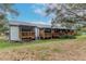 Back exterior view showing multiple townhouses with private wooden decks at 6289 93Rd N Ter # 4302, Pinellas Park, FL 33782