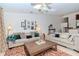 Spacious living room with two sofas, coffee table, and decorative wall art at 6289 93Rd N Ter # 4302, Pinellas Park, FL 33782