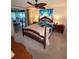 Cozy bedroom with wooden furniture and ceiling fan at 644 Blue Nw Ln, Port Charlotte, FL 33952