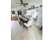 Dining room with view of the living room featuring ceiling fan and tile floor at 644 Blue Nw Ln, Port Charlotte, FL 33952