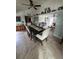 Dining room with view of the living room featuring ceiling fan and tile floor at 644 Blue Nw Ln, Port Charlotte, FL 33952