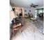 Open-concept living room with two seating areas, a dining area, and tile flooring at 644 Blue Nw Ln, Port Charlotte, FL 33952