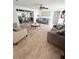Spacious living room with multiple seating areas, a coffee table, and tile floors at 644 Blue Nw Ln, Port Charlotte, FL 33952