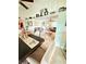 Open living area with comfortable seating, high ceilings, and decorative shelving at 644 Blue Nw Ln, Port Charlotte, FL 33952