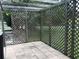 Paved patio area enclosed by a wooden lattice structure at 644 Blue Nw Ln, Port Charlotte, FL 33952