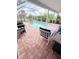 Inviting screened-in pool area with a patio, perfect for outdoor entertaining at 644 Blue Nw Ln, Port Charlotte, FL 33952