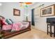 Charming bedroom with a wooden bed frame and colorful decor at 12865 Ione Way, Spring Hill, FL 34609