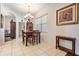 Dining room with wood table and chairs, chandelier, and hardwood floors at 12865 Ione Way, Spring Hill, FL 34609