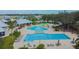 People lounging by and swimming in the resort-style community pool at 13010 Wildflower Meadow Dr, Riverview, FL 33579