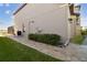 Side exterior view of home with AC unit, electrical box, and landscaped walkway at 13010 Wildflower Meadow Dr, Riverview, FL 33579