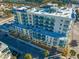 Aerial view of the condo building showcasing its architecture and surroundings at 15 Avalon St # 704, Clearwater Beach, FL 33767