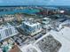 High-angle shot of the neighborhood featuring tennis courts, buildings, roads and the ocean at 15 Avalon St # 704, Clearwater Beach, FL 33767