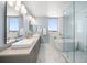 Modern bathroom with double sinks, and bathtub at 15 Avalon St # 704, Clearwater Beach, FL 33767