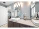 Bathroom featuring double sinks, grey cabinets, and modern fixtures with a mirror at 15 Avalon St # 704, Clearwater Beach, FL 33767
