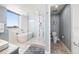 Bright bathroom features a soaking tub, a glass-enclosed shower, and modern fixtures with a great view at 15 Avalon St # 704, Clearwater Beach, FL 33767